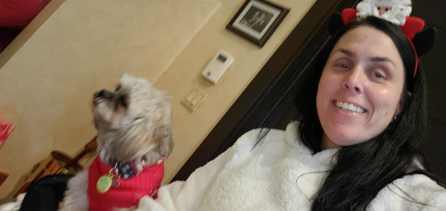 Paris in her red Christmas sweater with Momma in festive ears