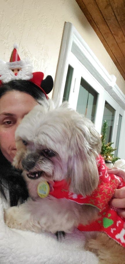 Momma in Santa Mickey ears holding Paris in her Christmas sweater