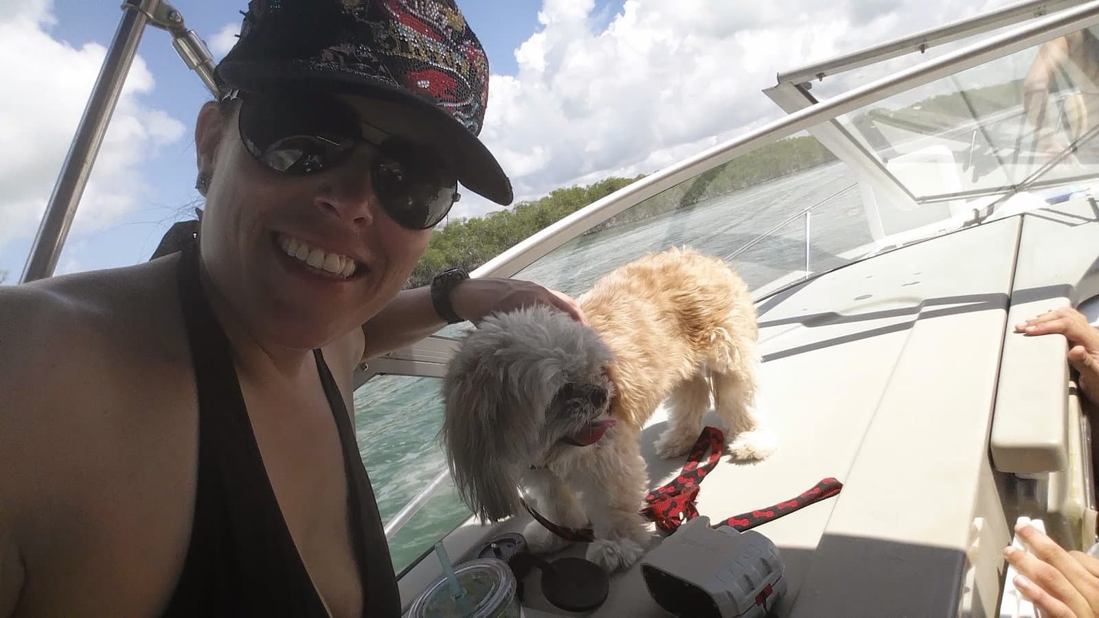 Paris and me smiling together on the boat out on the water