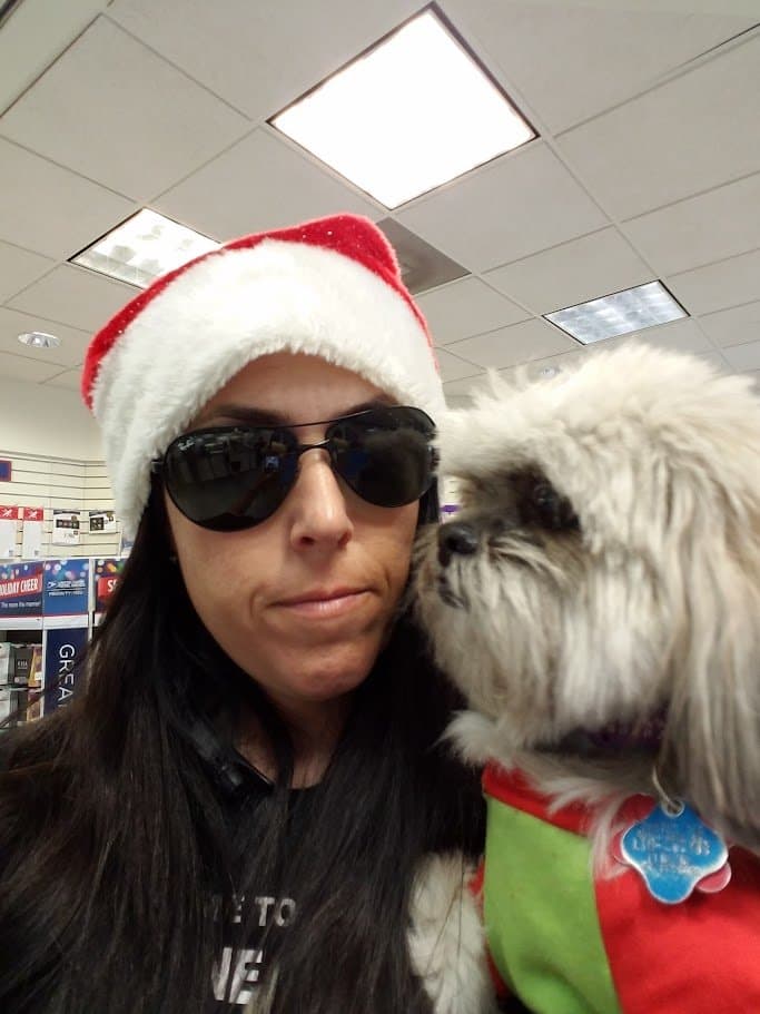 Paris giving Momma a kiss during a holiday errand.